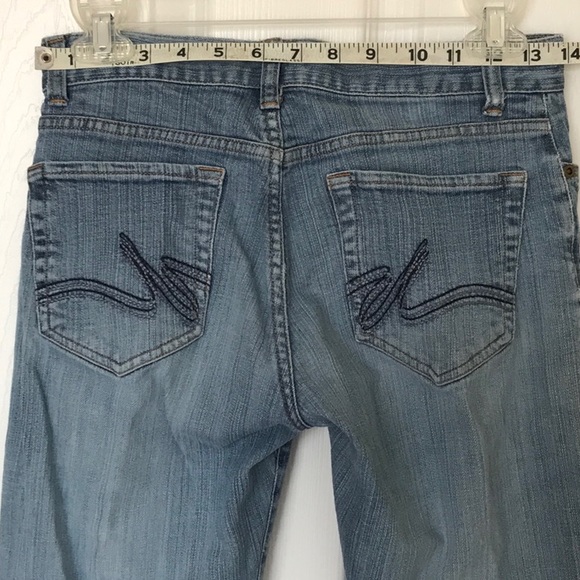 Daisy Fuentes boot cut naturally distressed clean worn jeans - Picture 4 of 9